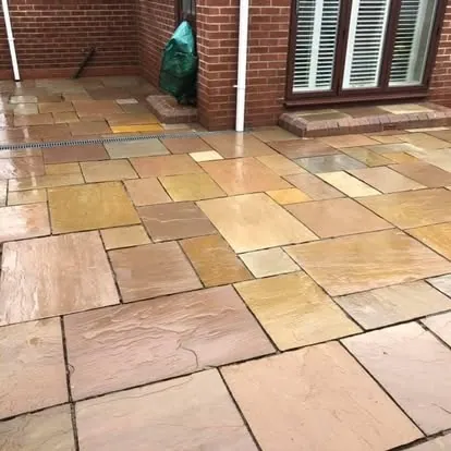 The same sandstone patio after cleaning, spotting removed