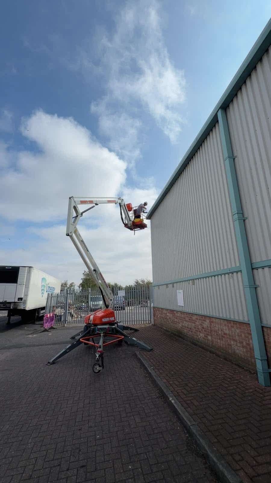 IGM cherry picker working on a commercial warehouse exterior in Teesside