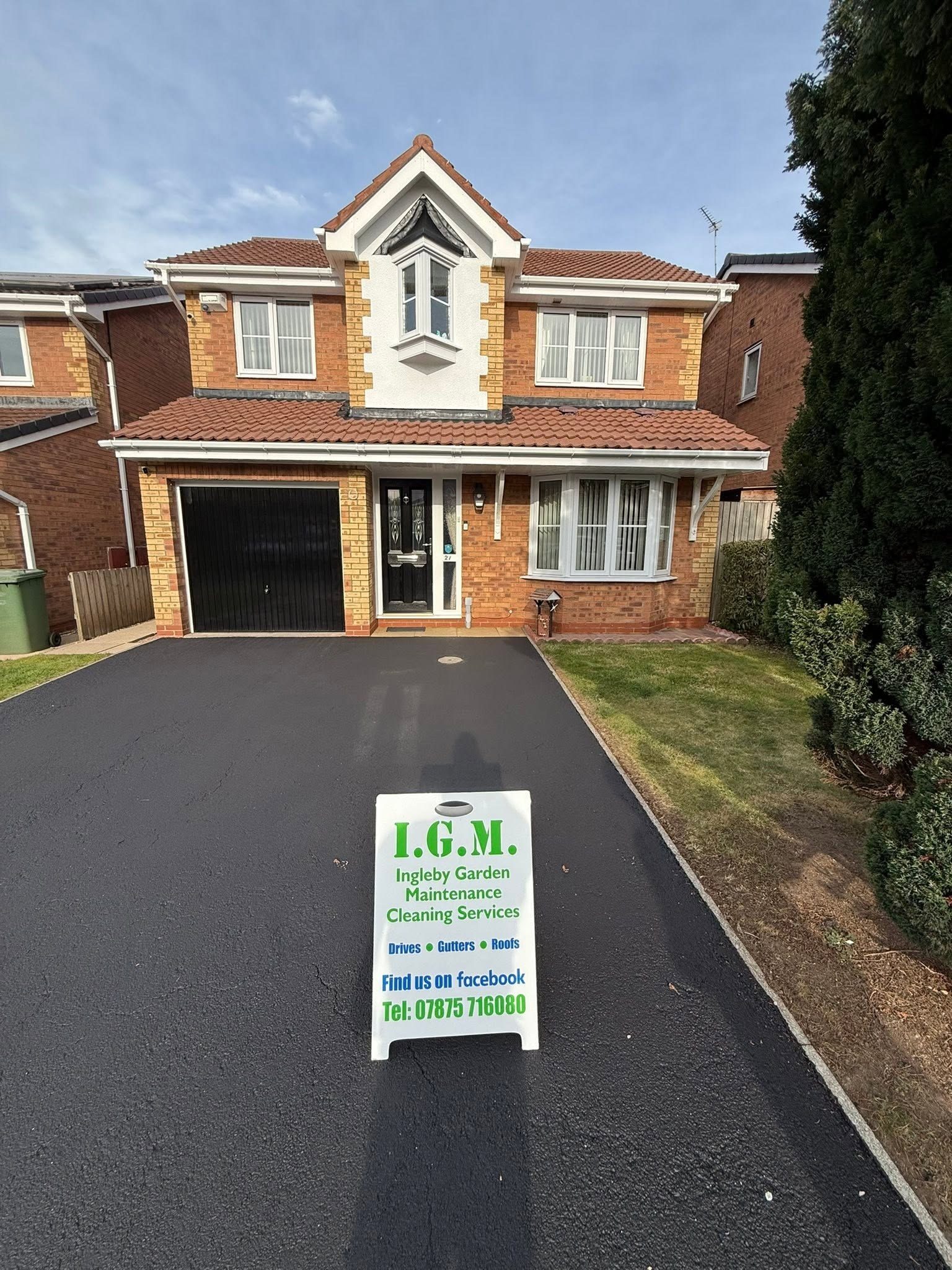 Tarmac driveway with IGM sign board, driveway cleaning in Billingham  Teesside by IGM